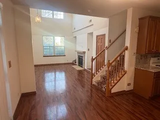 a view of an entryway with wooden floor