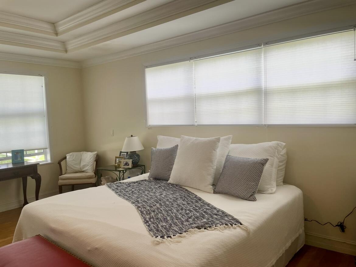 950 Marble Way Boca Raton, FL 33432 - Photo 5 of 10 a bedroom with a bed and window