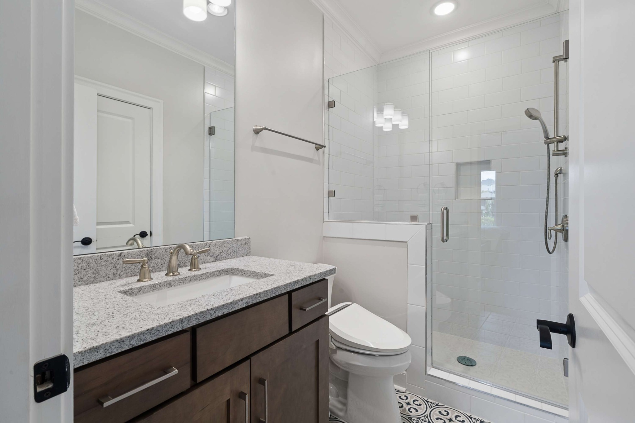 6004 Lookaway Circle Franklin, TN 37067 - Photo 53 of 71 a bathroom with a granite countertop sink a toilet and shower