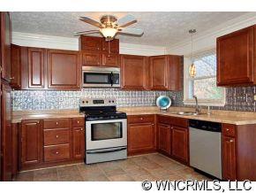 42 West Oakview Road Asheville, NC 28806 - Photo 3 of 12 a kitchen with a sink stove and microwave