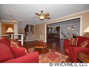 42 West Oakview Road Asheville, NC 28806 - Photo 6 of 12 a living room with furniture a rug and a chandelier