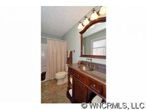 42 West Oakview Road Asheville, NC 28806 - Photo 9 of 12 a bathroom with a sink a toilet and a mirror