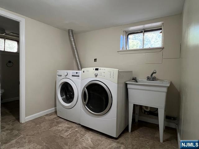 159 Henry Street Teaneck, NJ 07666 - Photo 16 of 19 a utility room with dryer and washer