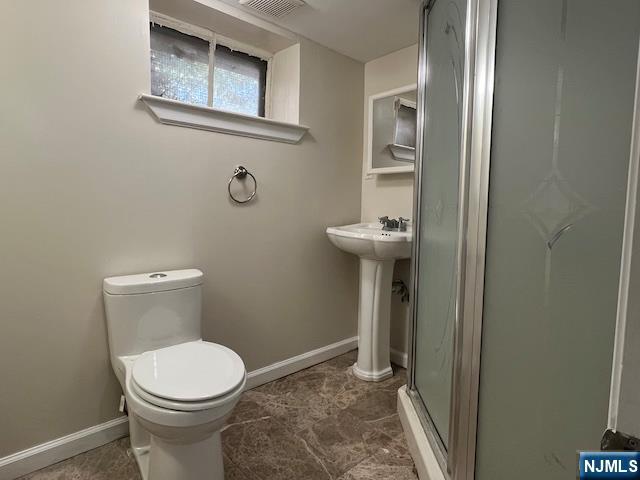 159 Henry Street Teaneck, NJ 07666 - Photo 17 of 19 a bathroom with a toilet and a sink