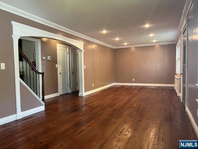 159 Henry Street Teaneck, NJ 07666 - Photo 3 of 19 an empty room with wooden floor and a hallway
