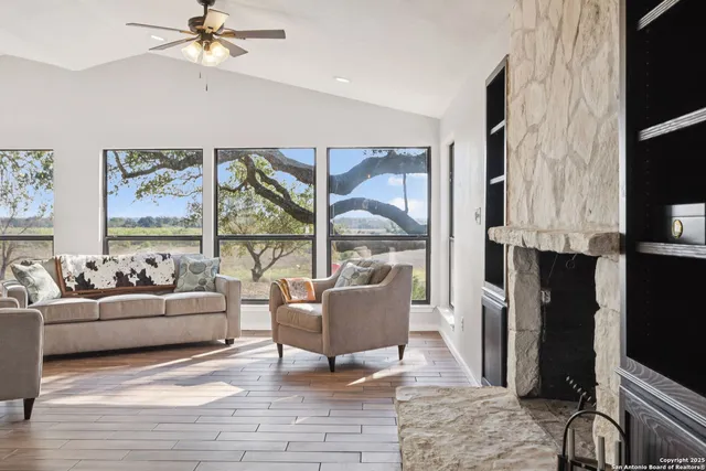 a living room with furniture and a fireplace