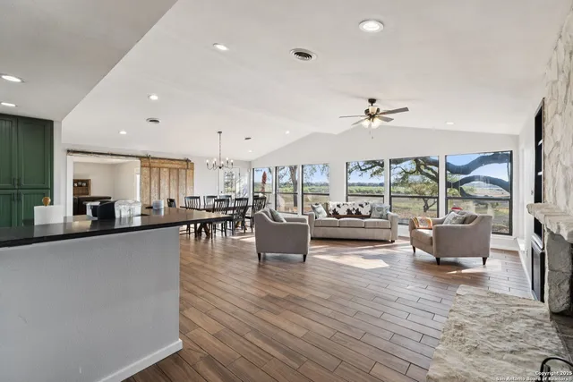 a living room with furniture and a fireplace