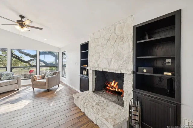 a living room with furniture and a fireplace