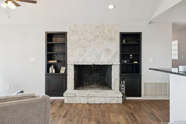 a dining room with furniture window and wooden floor
