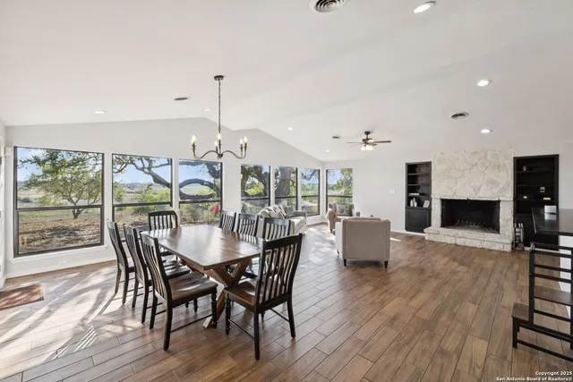 a bedroom with furniture and wooden floor