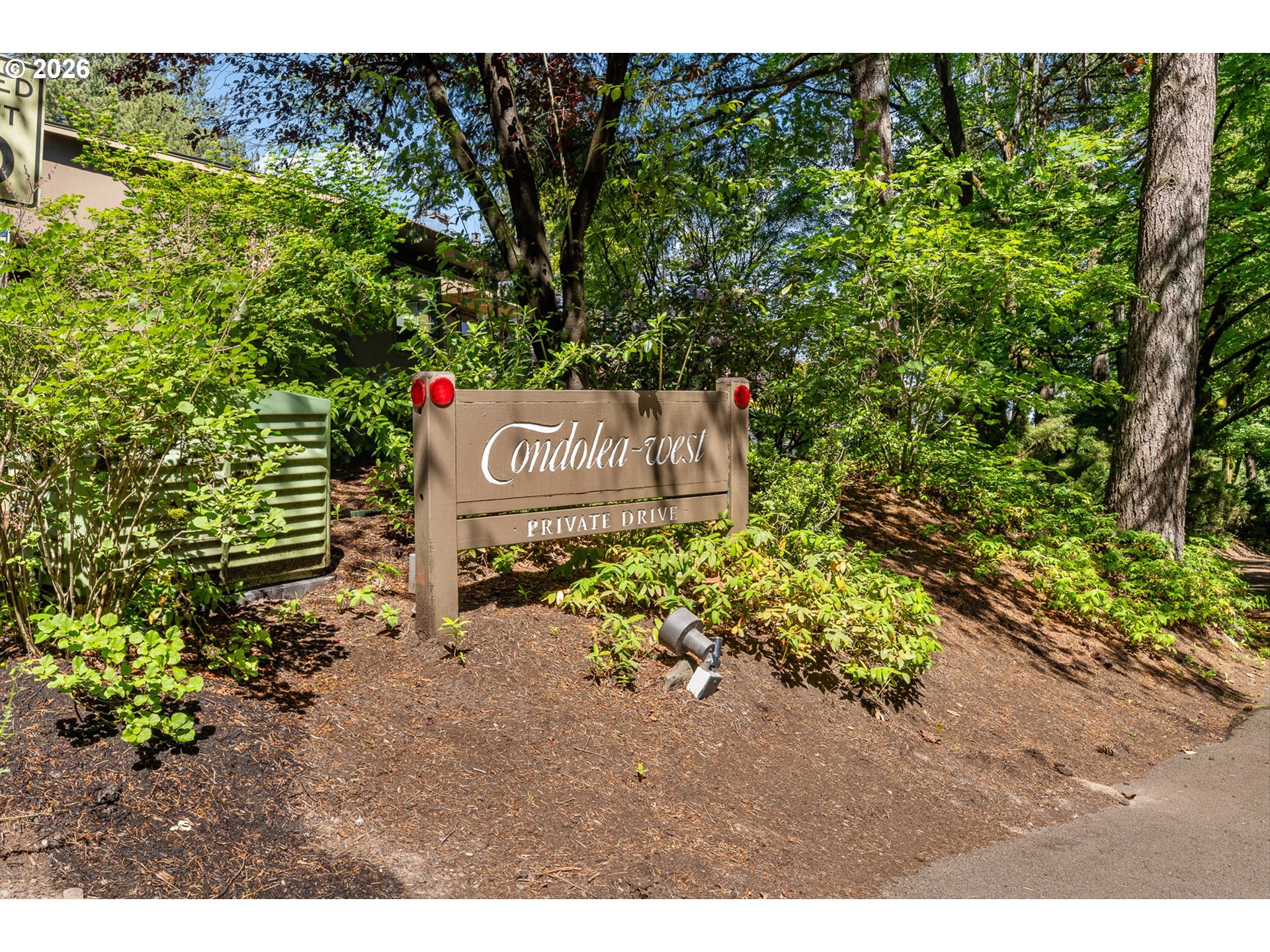 77 Condolea Way Lake Oswego, OR 97035 - Photo 23 of 25 a sign that is sitting in the middle of a forest