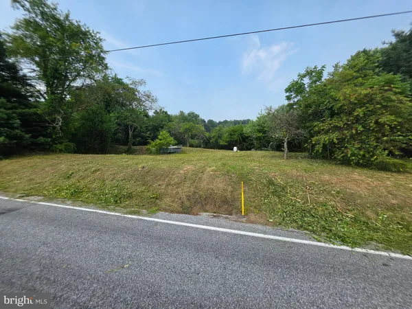 a view of a field with an outdoor space