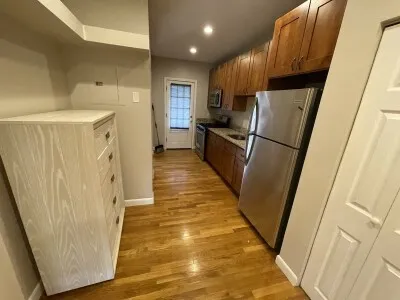 a view of a kitchen from the hallway