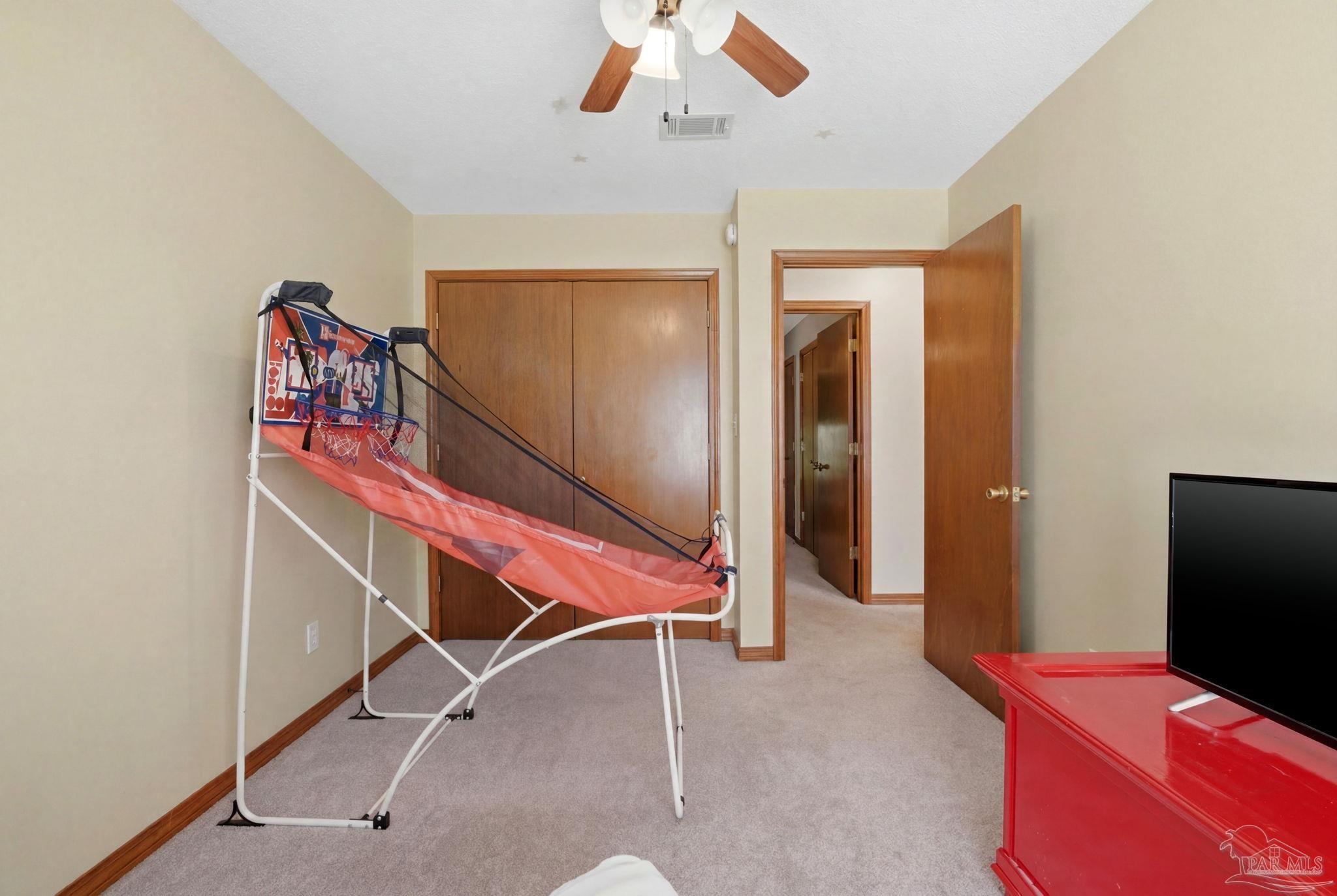 6870 Martin Road Milton, FL 32570 - Photo 29 of 48 a bedroom with a bed and a ceiling fan