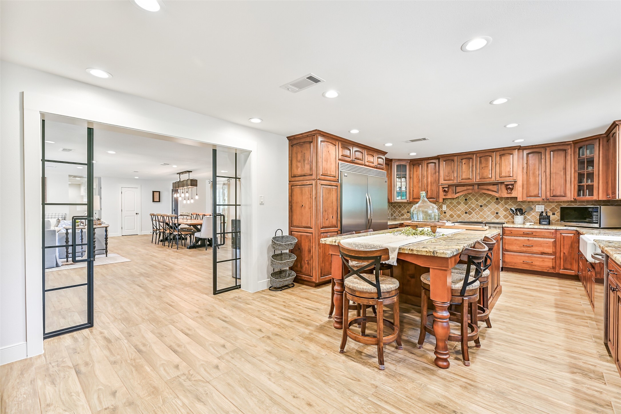 3042 Poskey Road Anahuac, TX 77514 - Photo 11 of 50 Expansive kitchen featuring a granite island with generous bar seating.