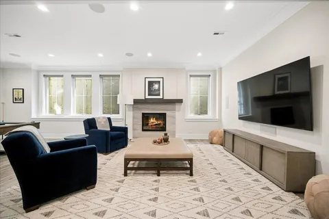 a view of a patio with couches and a fire pit
