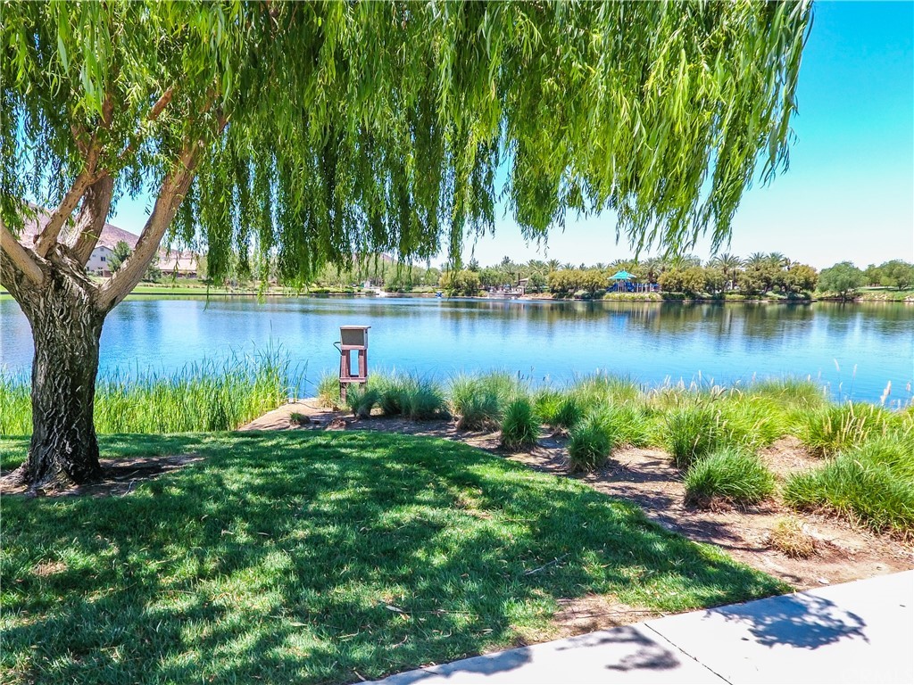 29957 Maritime Way Menifee, CA 92585 - Photo 18 of 25 a view of a lake with a house in the background