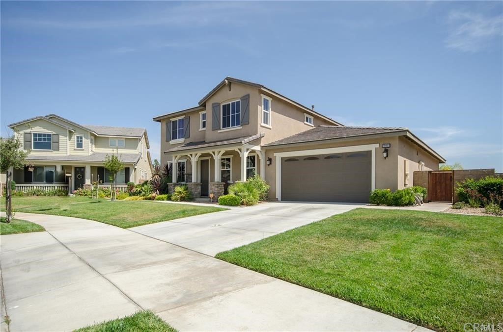 29957 Maritime Way Menifee, CA 92585 - Photo 2 of 25 a front view of a house with a yard and garage