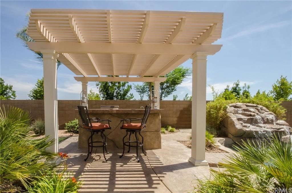 29957 Maritime Way Menifee, CA 92585 - Photo 5 of 25 a patio with glass top table and chairs