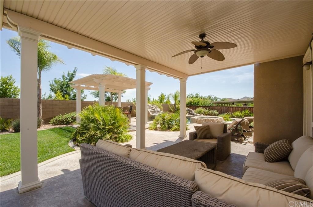 29957 Maritime Way Menifee, CA 92585 - Photo 8 of 25 a living room with patio furniture and garden view