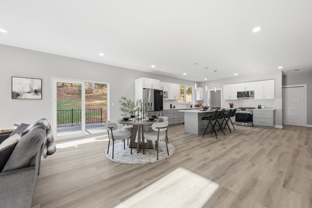 287 Whitney Avenue Holyoke, MA 01040 - Photo 16 of 40 a view of a dining room with furniture window and outside view