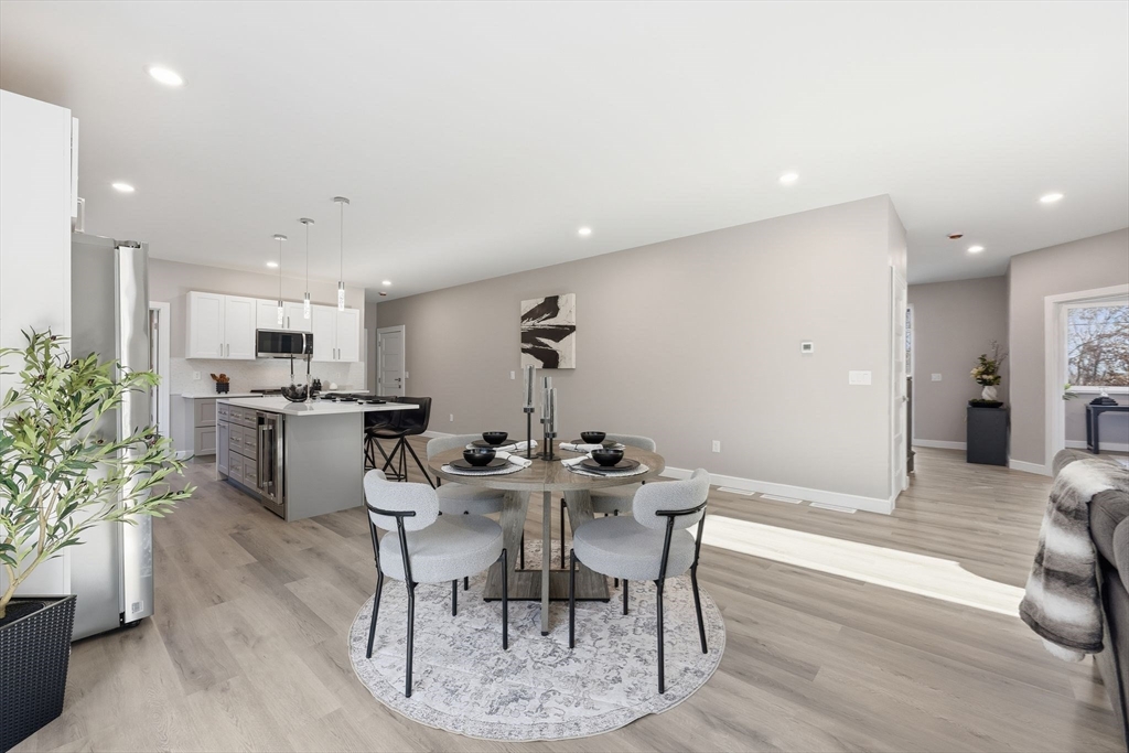 287 Whitney Avenue Holyoke, MA 01040 - Photo 17 of 40 a view of a dining room with furniture