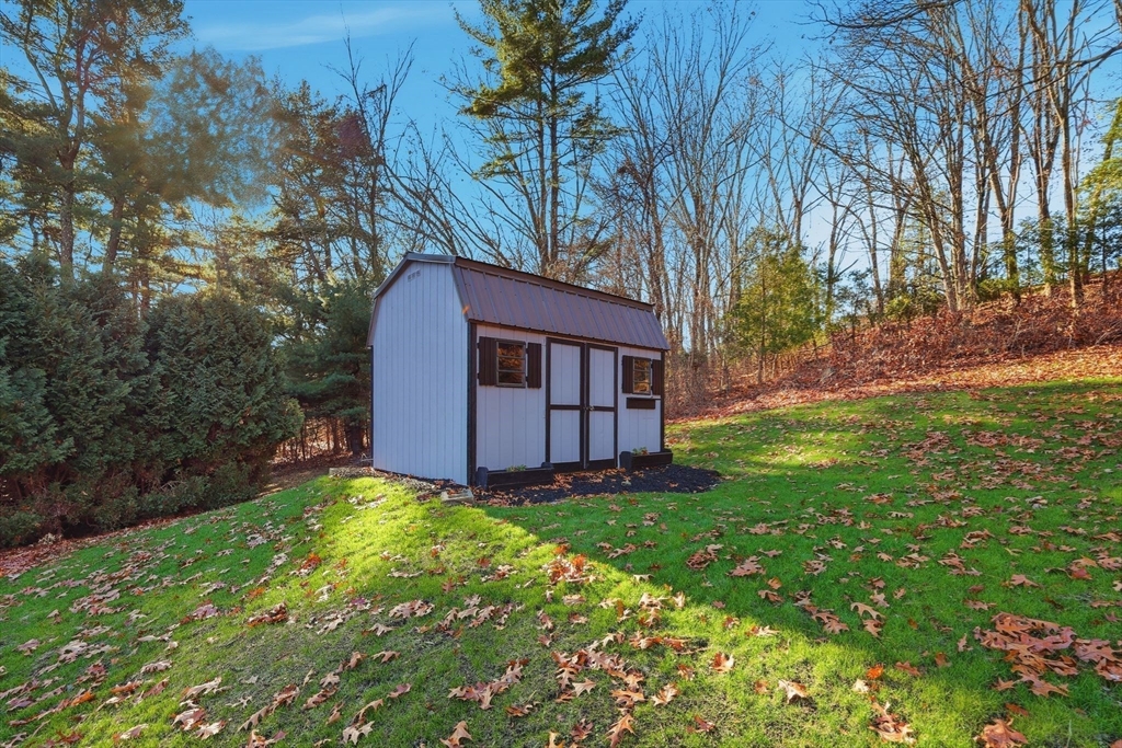 287 Whitney Avenue Holyoke, MA 01040 - Photo 36 of 40 a view of a house with a yard and large trees