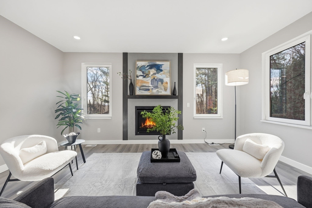 287 Whitney Avenue Holyoke, MA 01040 - Photo 8 of 40 a living room with furniture and a large window