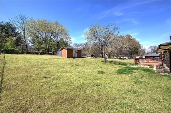 a view of a field with of trees