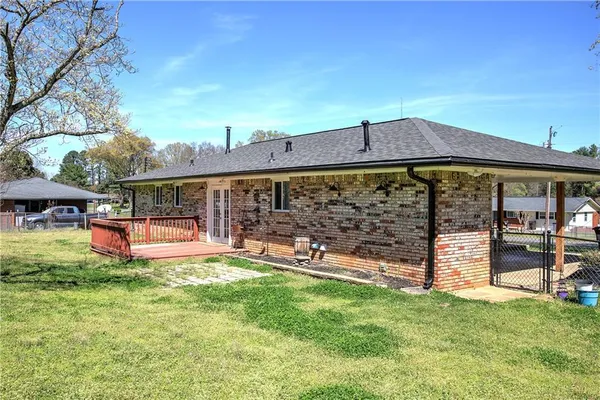 an outdoor view of the house with backyard