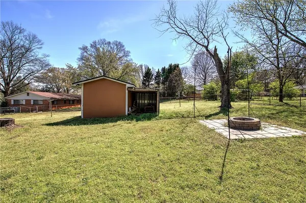 a backyard of a house with lots of green space