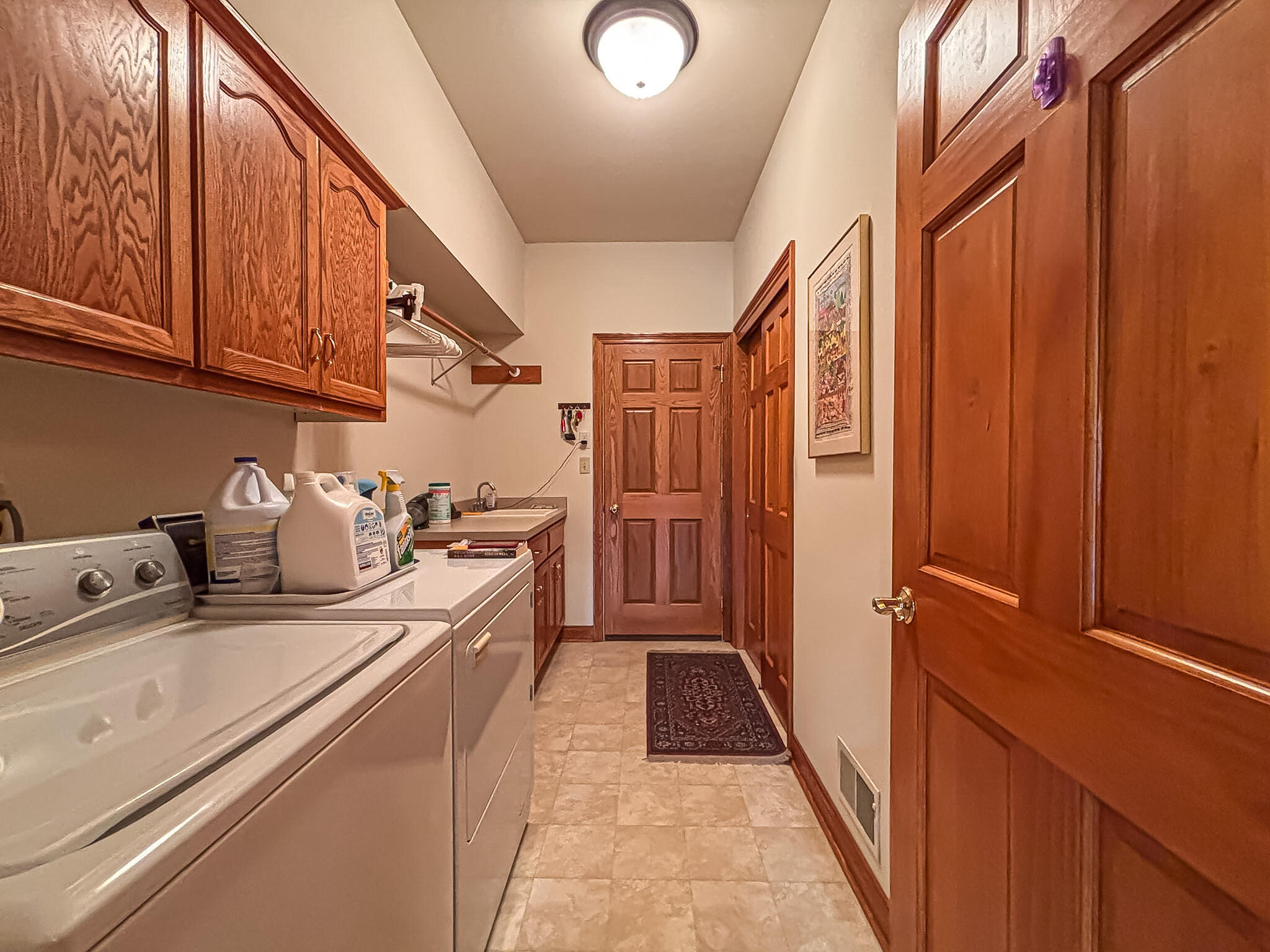 N22W26746 Shooting Star Road Pewaukee, WI 53072 - Photo 21 of 38 Main Floor Laundry