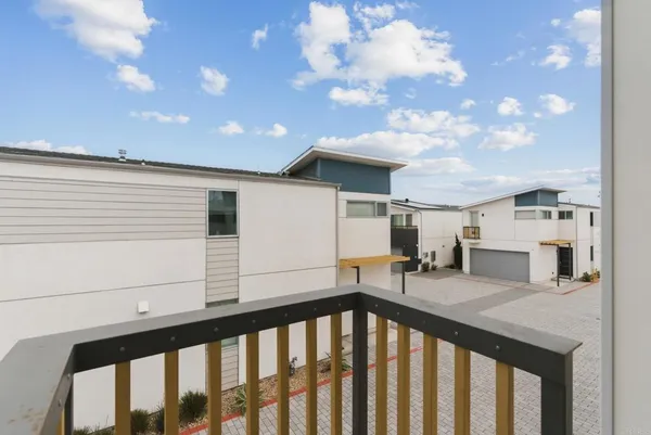 a view of a porch with a table and chairs
