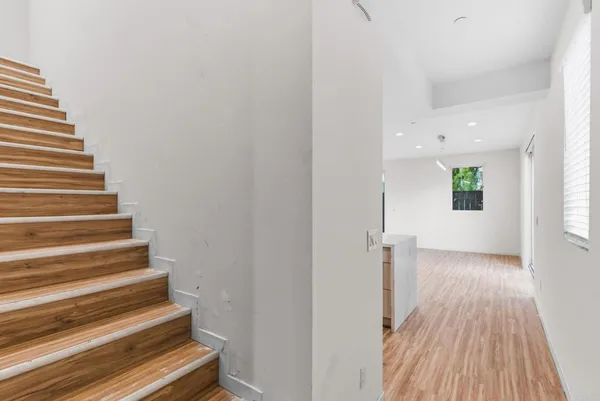 a view of entryway with wooden floor