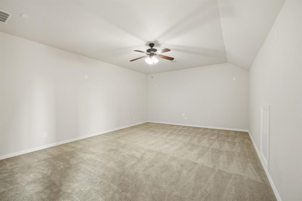 12809 Spring Hill Drive Frisco, TX 75035 - Photo 36 of 37 an empty room with windows and ceiling fan