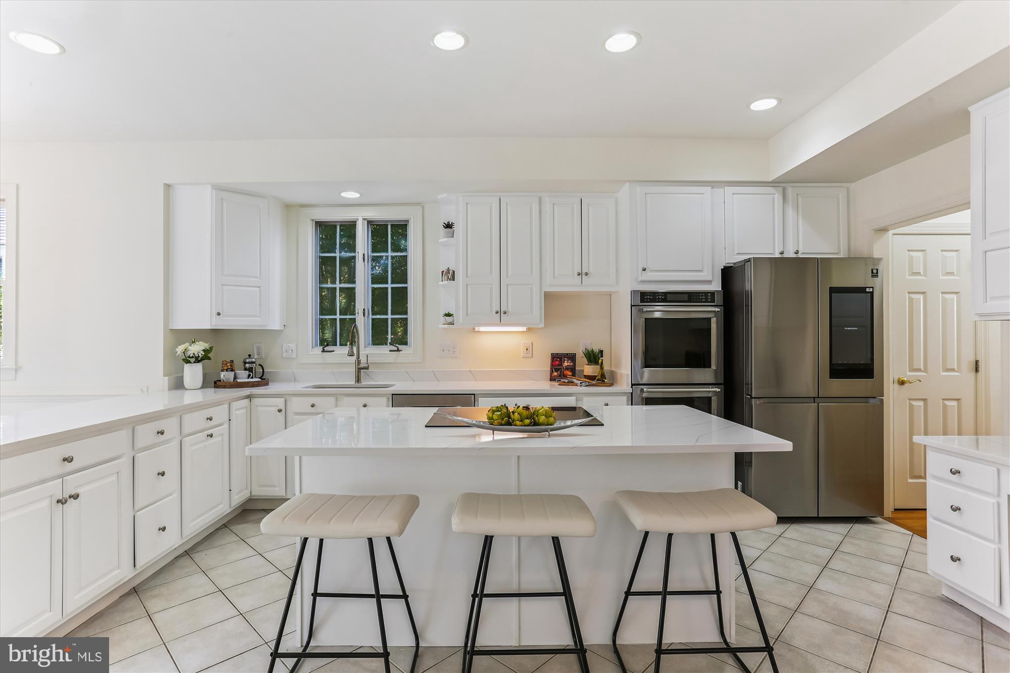403 Kent Oaks Way Gaithersburg, MD 20878 - Photo 12 of 76 a kitchen with stainless steel appliances kitchen island granite countertop a refrigerator and a stove top oven