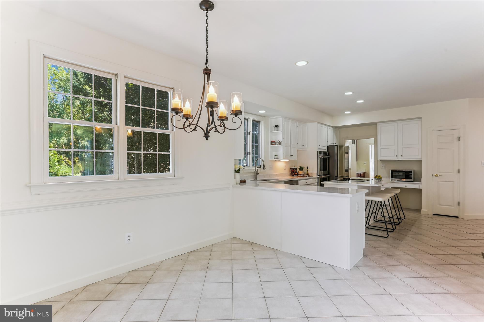 403 Kent Oaks Way Gaithersburg, MD 20878 - Photo 18 of 76 a kitchen with white cabinets and window