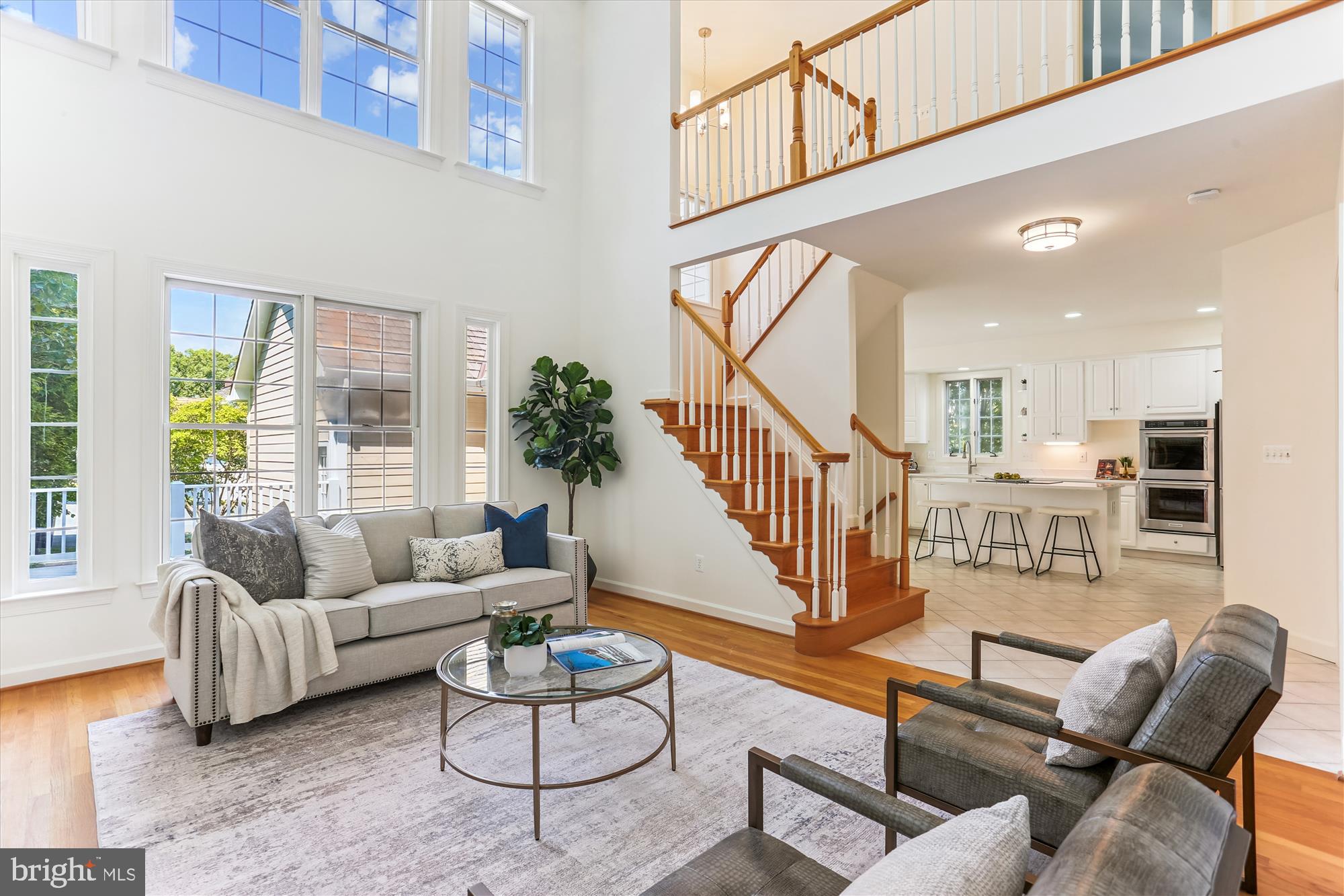 403 Kent Oaks Way Gaithersburg, MD 20878 - Photo 20 of 76 a living room with furniture or stairs and a wooden floor