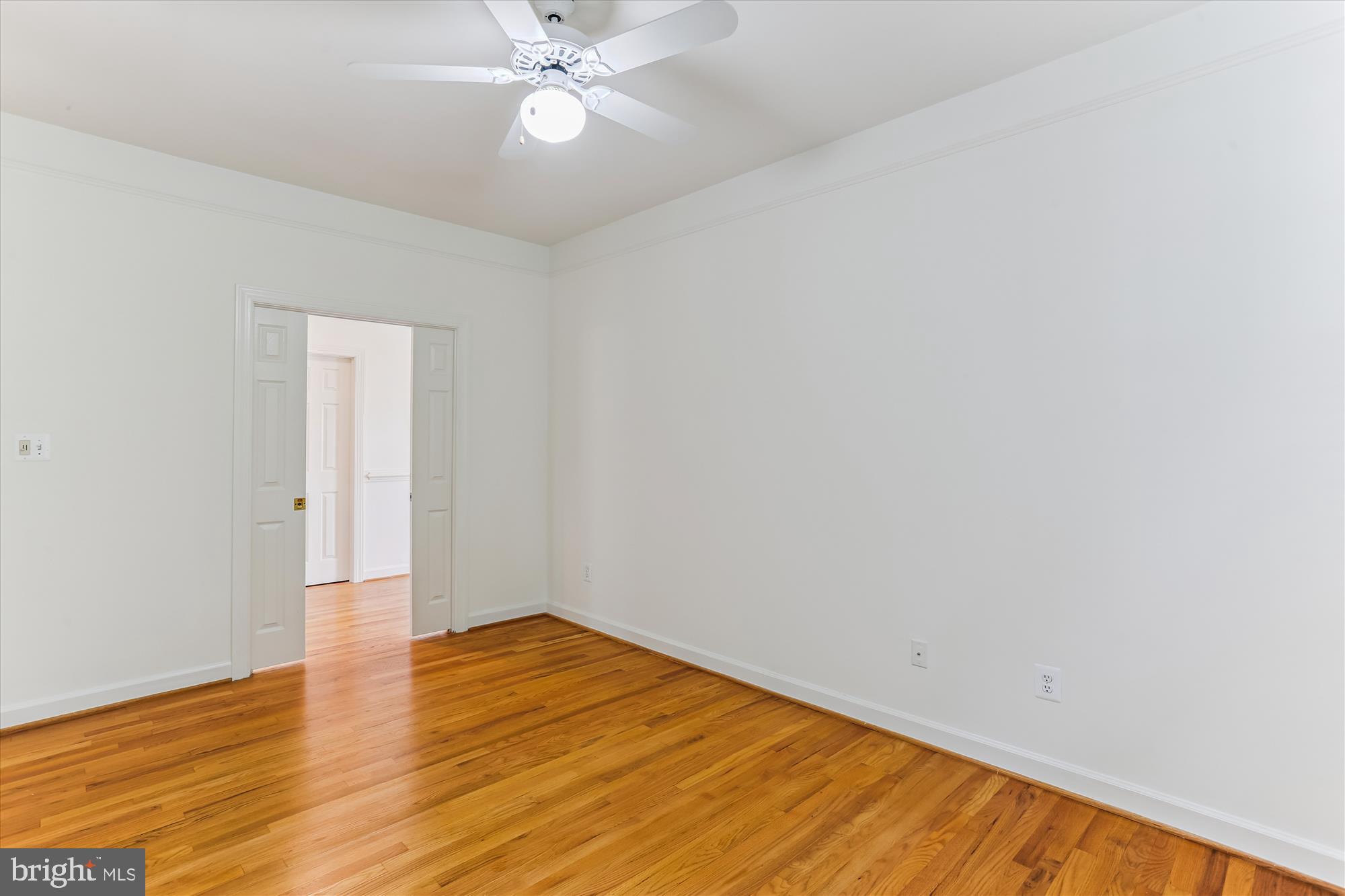 403 Kent Oaks Way Gaithersburg, MD 20878 - Photo 27 of 76 a view of an empty room with wooden floor