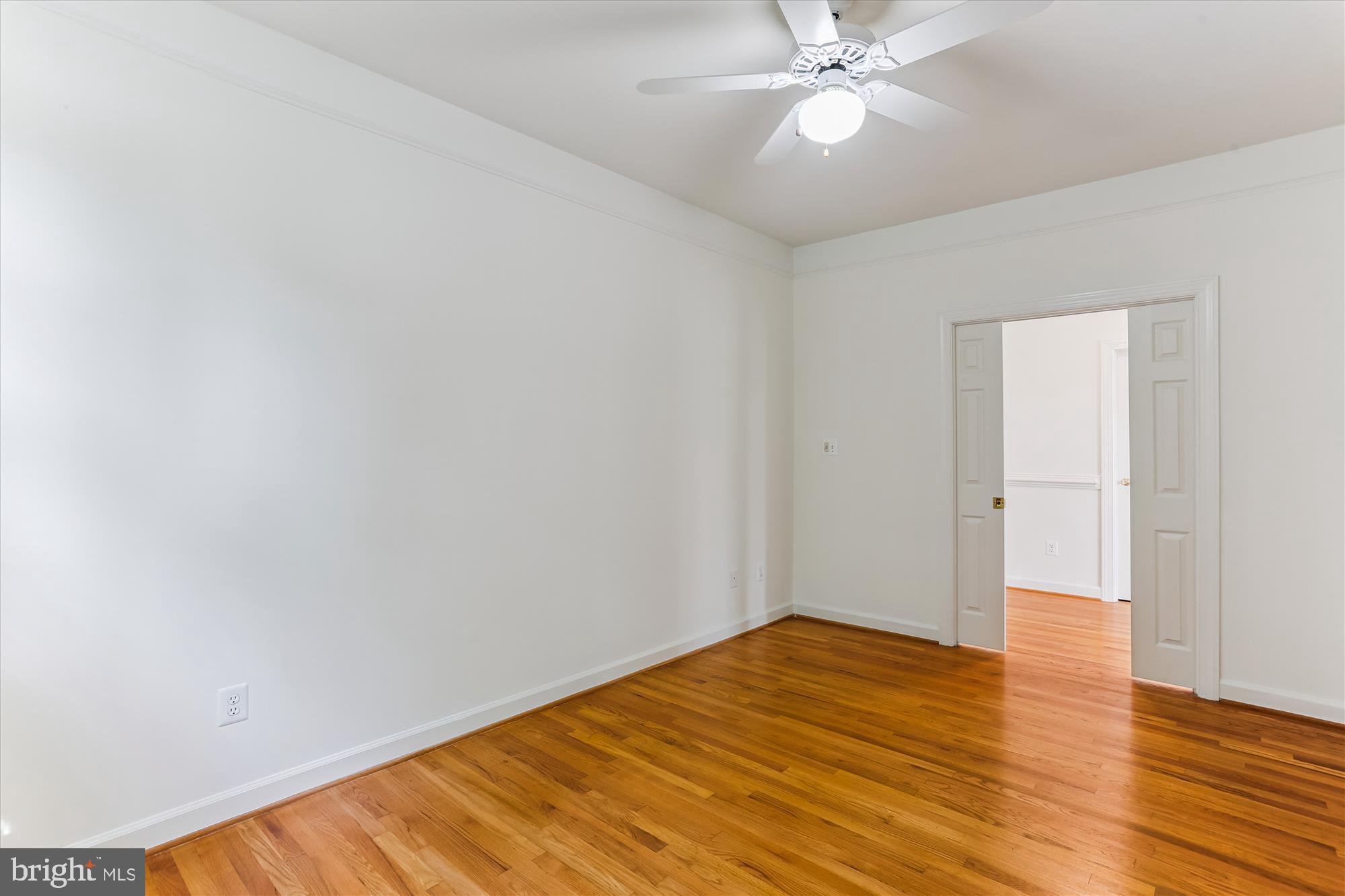 403 Kent Oaks Way Gaithersburg, MD 20878 - Photo 28 of 76 a view of a room with wooden floor and a ceiling fan