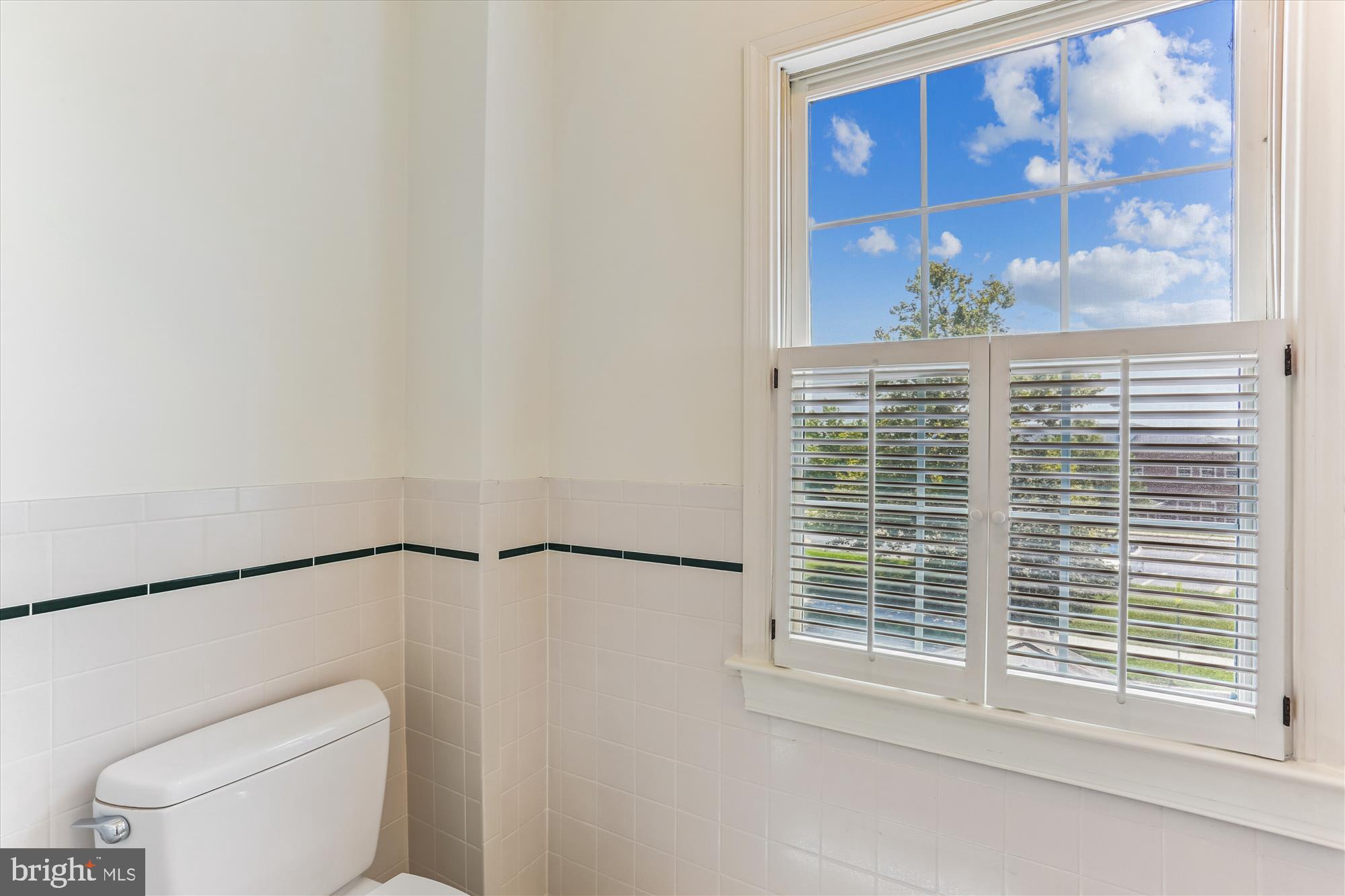 403 Kent Oaks Way Gaithersburg, MD 20878 - Photo 45 of 76 a bathroom with a toilet a sink and a window