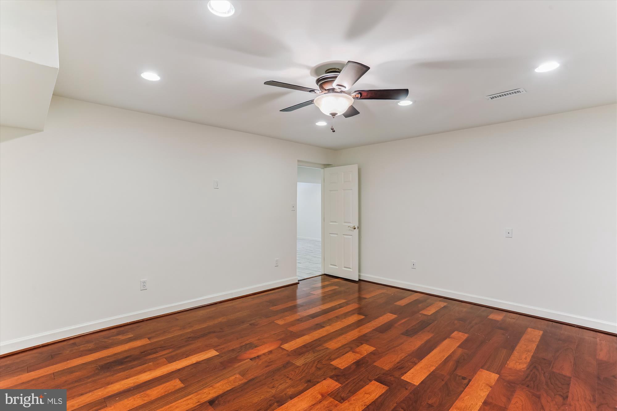 403 Kent Oaks Way Gaithersburg, MD 20878 - Photo 51 of 76 a view of an empty room with wooden floor