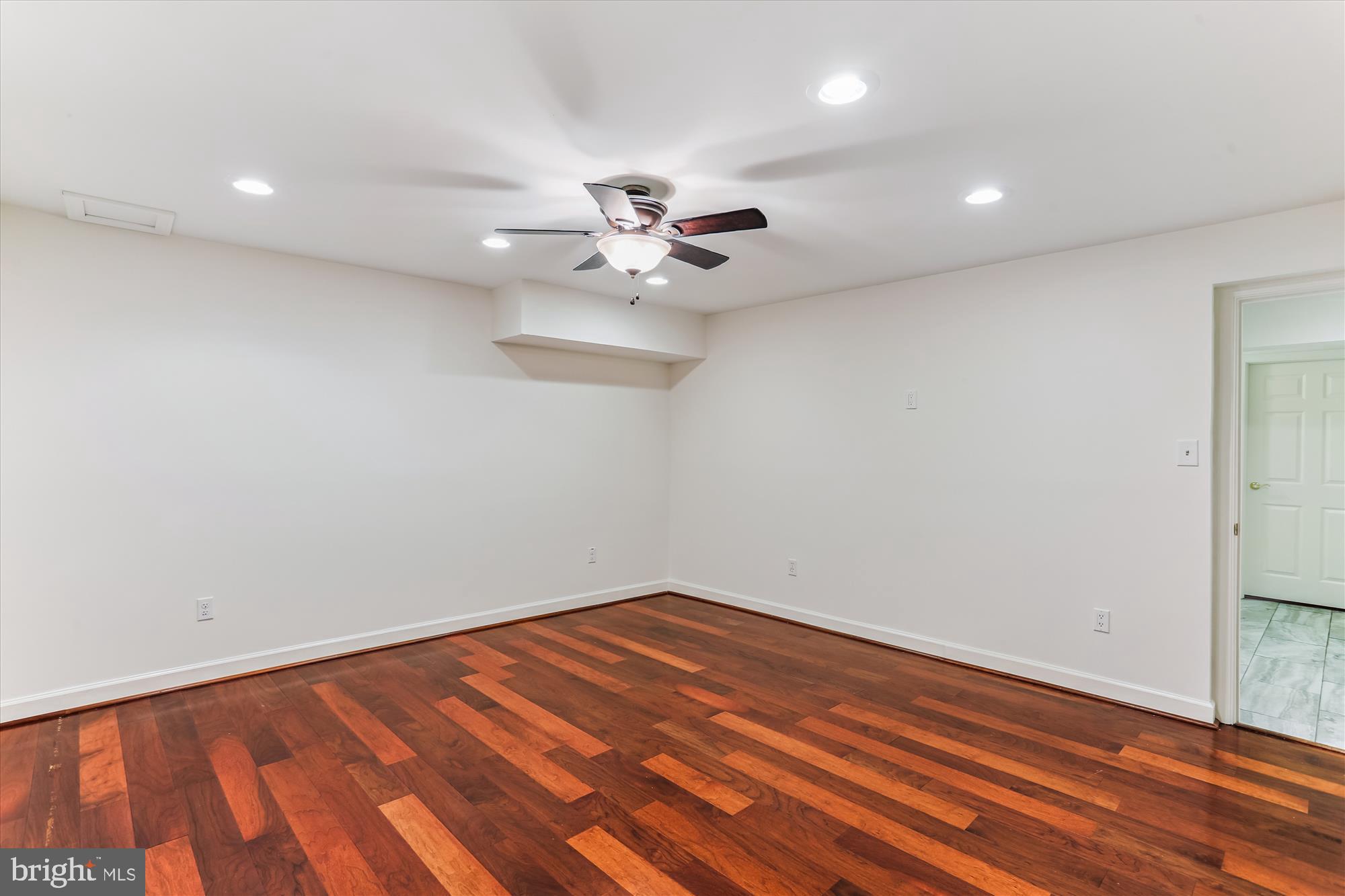 403 Kent Oaks Way Gaithersburg, MD 20878 - Photo 52 of 76 wooden floor in an empty room with a window