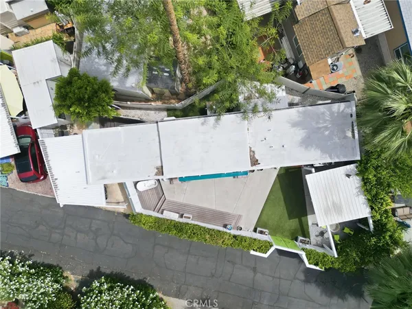 an aerial view of a house with an outdoor space