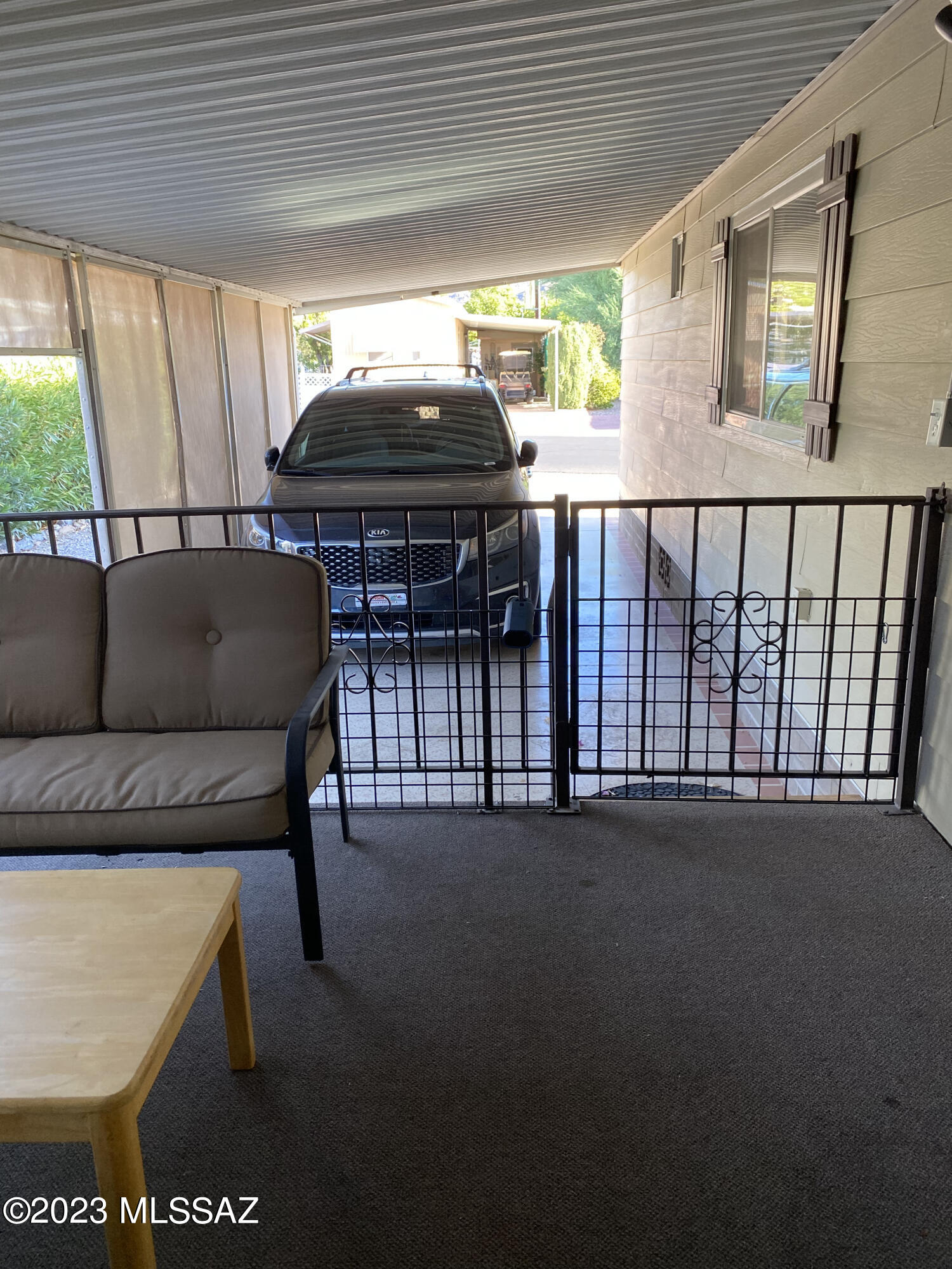 5755 West Box R Street Tucson, AZ 85713 - Photo 12 of 33 Extended carport with storage under the porch