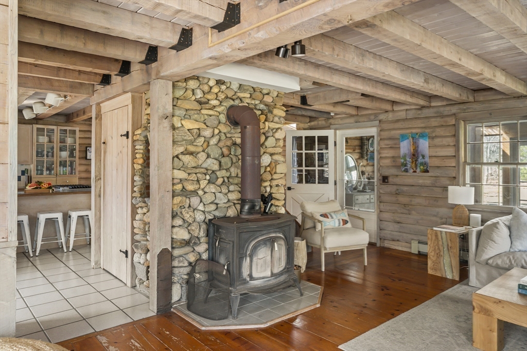 7 Pip'n Road Edgartown, MA 02539 - Photo 7 of 41 a living room with furniture a wooden floor and chandelier