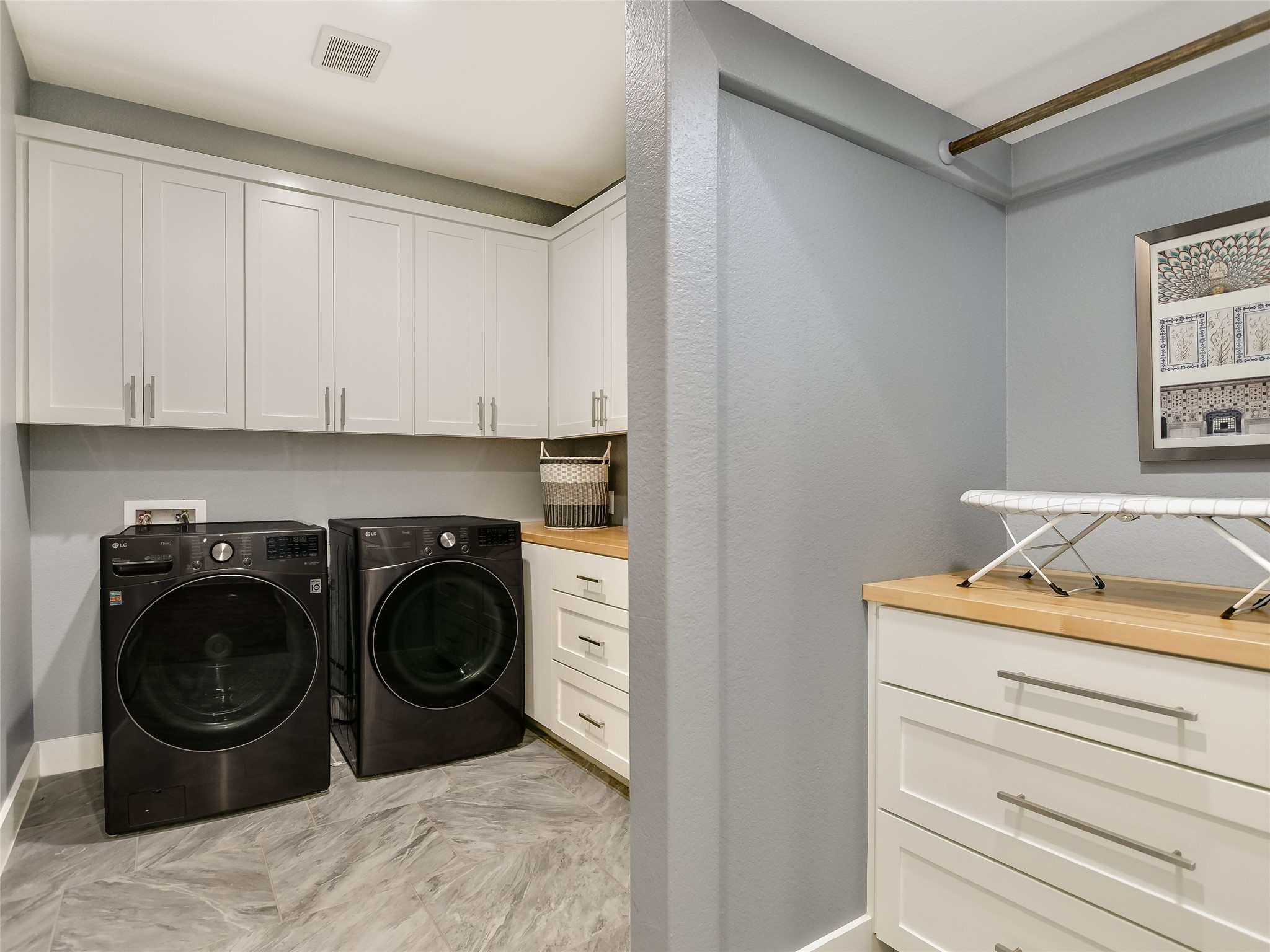 19819 Lockwood Road Manor, TX 78653 - Photo 19 of 29 This exceptional laundry room goes above and beyond with custom cabinetry, generous workspace, and a layout that makes chores a breeze.