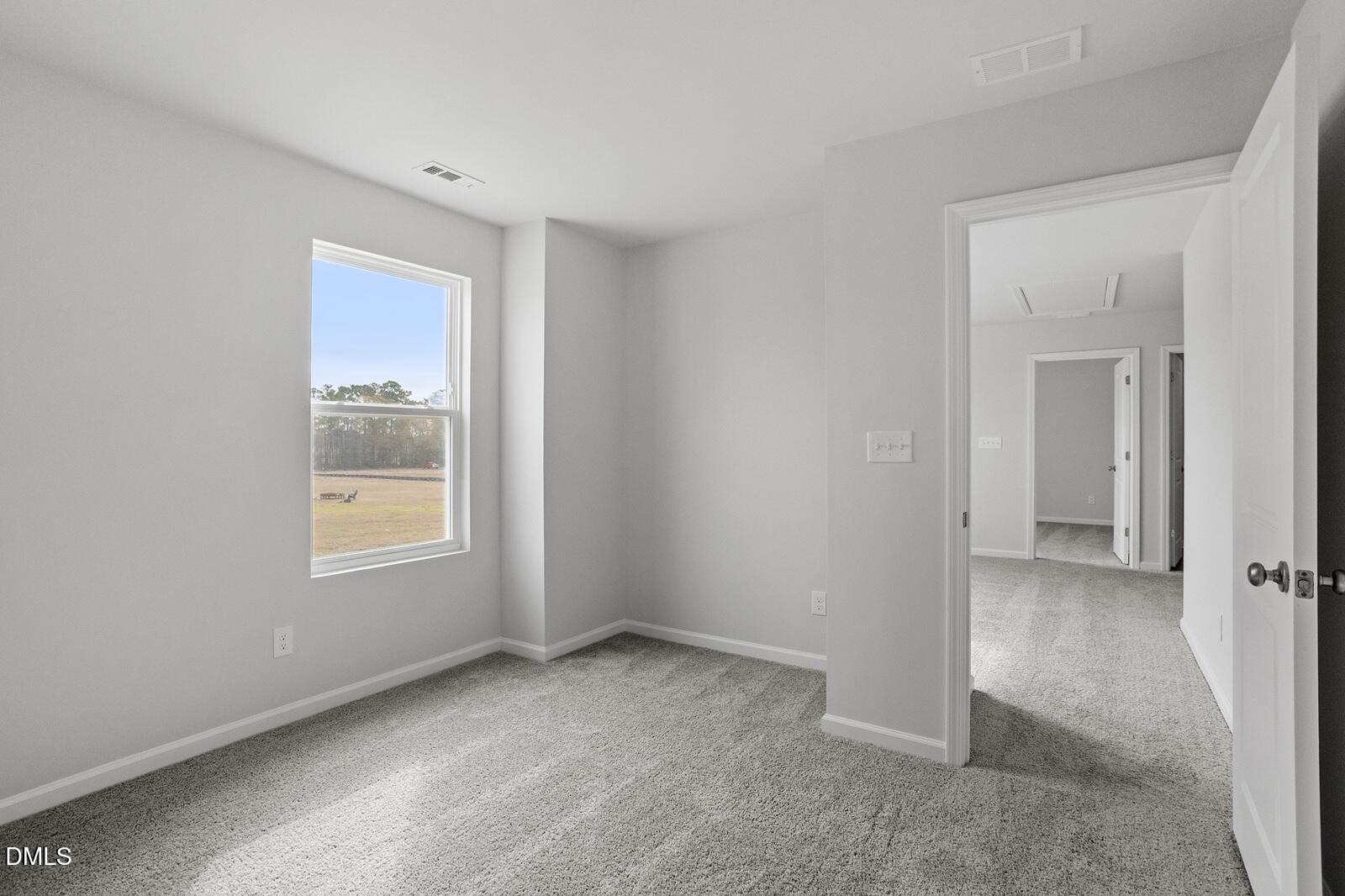 79 Osgood Street Angier, NC 27501 - Photo 27 of 31 a view of an empty room with a window