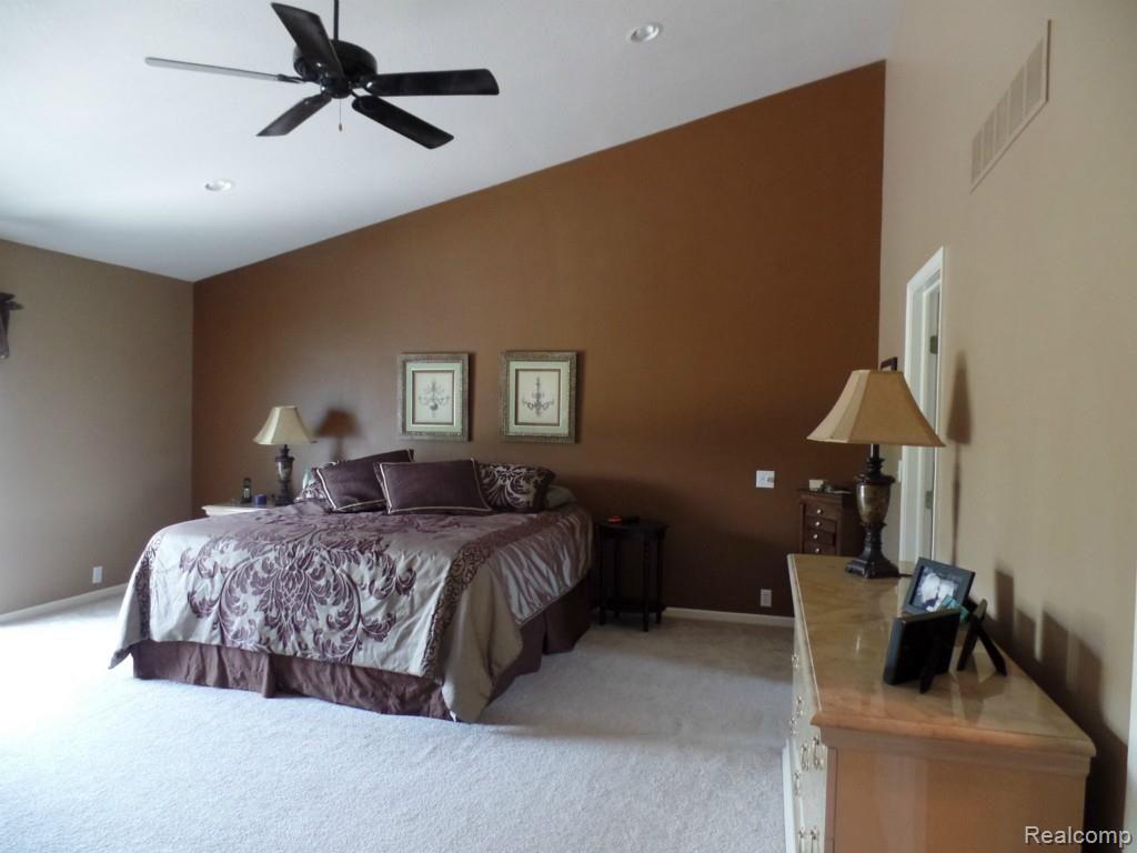 6340 Vassar Road Grand Blanc, MI 48439 - Photo 22 of 51 Another view of the private master bedroom suite. Note the vaulted ceiling and tasteful neutral contemporary color selections.