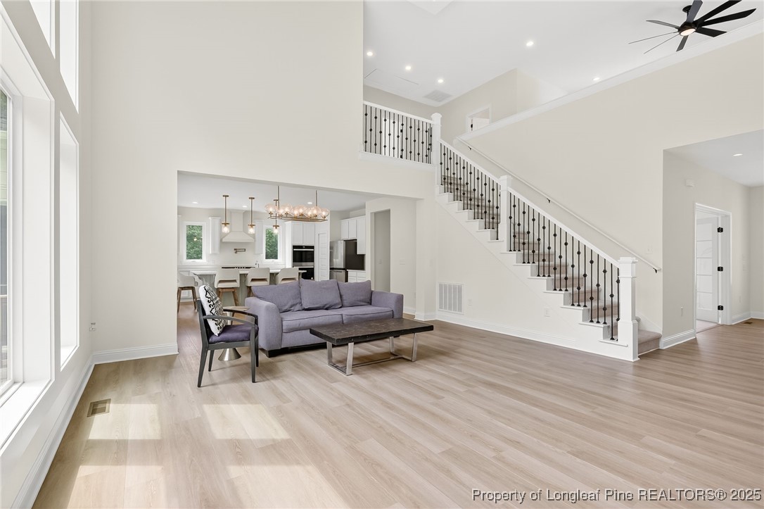 197 Silverside Drive Angier, NC 27501 - Photo 11 of 48 a living room with furniture and wooden floor